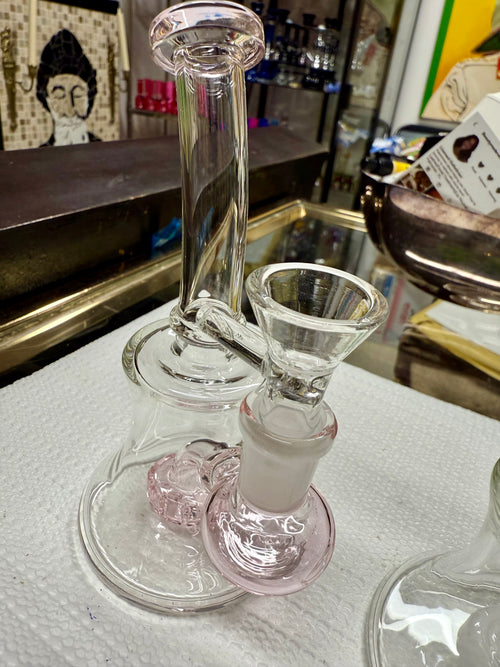Ripkitty 7" conical bong — color shower iridescent neck, green base accent, angled front view showing bell base, percolator chamber, and 14mm funnel bowl with handle